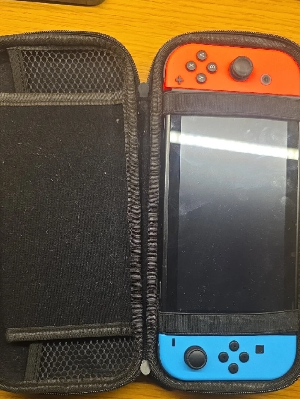 Nintendo Switch with Red and Blue Joy-Con Controllers